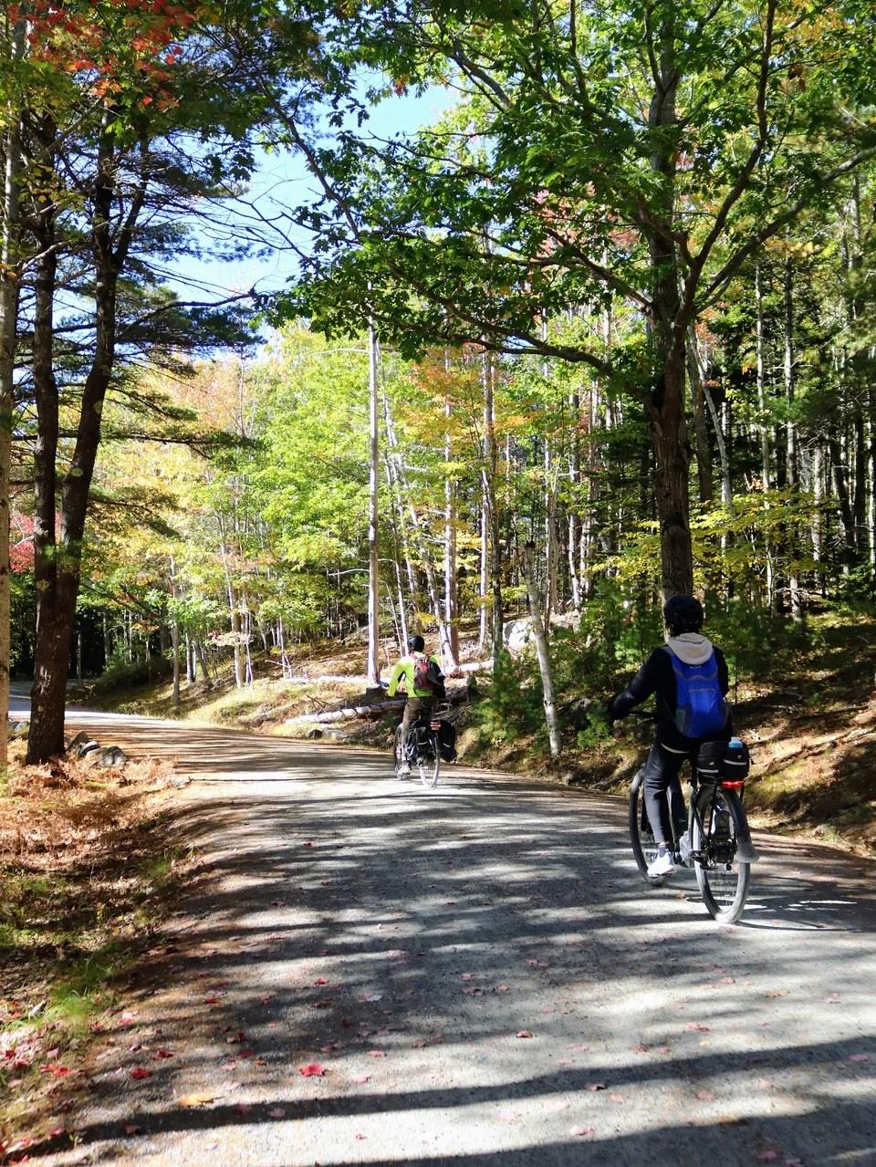 Island Time Acadia rental e-bikes with helmets and a carriage-road route map